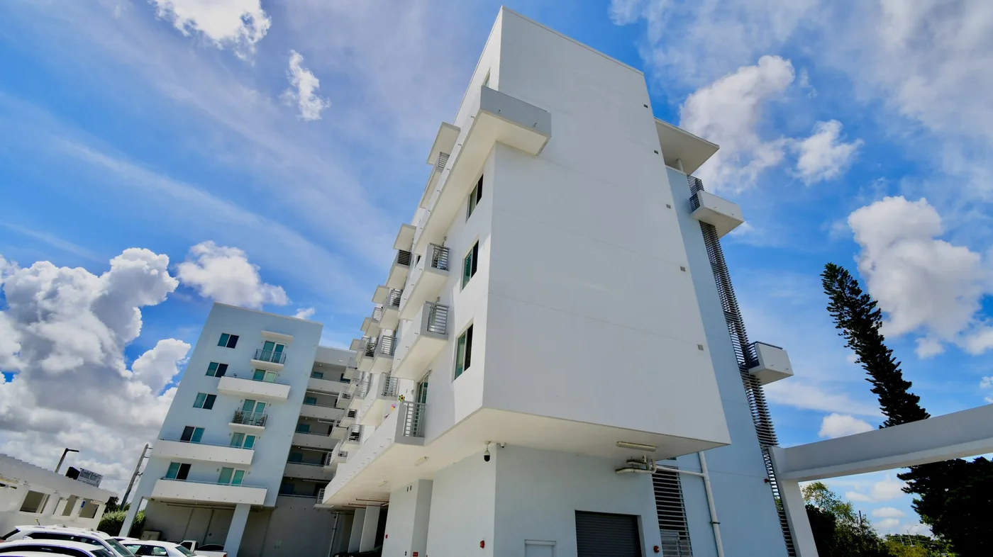 Completed white multi-story residential exterior repaint