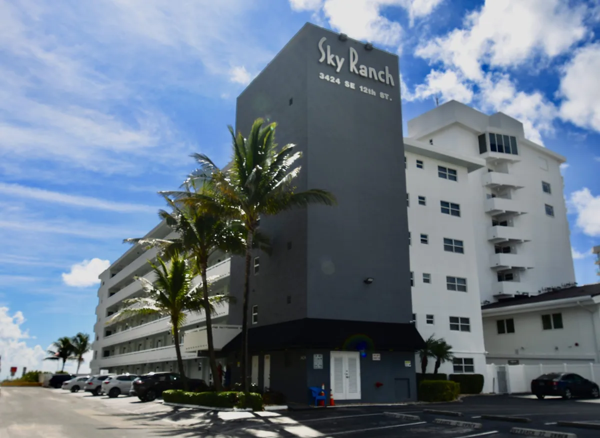 Repainted multi-story commercial building with dark gray finish